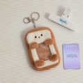 Detail of plush toast card holder featuring soft brown fur and clear window pocket - Brown Toast