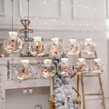 Christmas tree decorative LED baubles with snowman figures and warm white lighting - Christmas Snowman Globe Hanging Lights