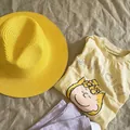 Chic yellow woven straw sun hat for women and kids, perfect for beach vacation styling - Yellow