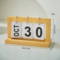 Minimalist wooden flip calendar with metal rings showing October 30 date in light wood finish - Assembly Style / Old Wood (English Card)