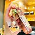 Bubble tea beer sleutelhanger met vloeibare bedel en bruine siliconen polsband - Platte Snoepbeer