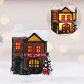 Miniature resin LED Christmas fire station with artificial snow and warm glowing light - Model C House