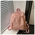 Dettaglio dello zaino mini rosa con motivi di tulipani e trama in nylon liscio - Rosa