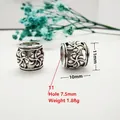 Detailed view of antique silver hollow floral spacer beads with 7.5mm large hole - Style 11 (Spiral Floral)