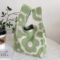 Floral green and white knit handbag shown on a cozy table setting for women - Green Floral