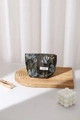 Close-up of vintage dark green satin cosmetic bag with blue floral embroidery and gold charm - Golden Thread Flower Small