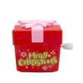 Mechanical wind-up Christmas gift box toy in red with pink bow and gold lettering - Wind-up Gift Box