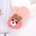 Detail of pink knitted baby mittens with 3D cartoon bear ears and soft winter texture - Pink