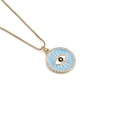 Detail of gold evil eye pendant with blue enamel and pavé zircons on box chain - Light Blue