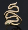 Fashionable gold snake ring featuring white pave zircons and green gemstone eyes - Green Snake