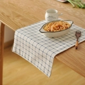 French country style blue and white checkered linen napkin draped on a wooden table - Light Blue Plaid Check