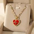Golden necklace with red heart pendant and rhinestone trim in a beige gift box - Red Heart Pendant Lip Chain (NE223嘴唇链)