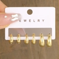 Three-piece set of golden teardrop hoop earrings in various sizes on white display card - Gold Teardrop Hoop Set (5791704)