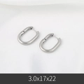 Sleek silver stainless steel U-shaped oval hoop earrings on white fabric base - 3*17*22mm / Steel
