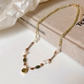Detailed close-up of handmade vintage beaded necklace with green gemstone and pearls - Green (18K Gold Plated)