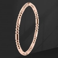 Pulsera de acero de titanio en oro rosa pulido con eslabones de cuentas y cilindros - Oro rosa