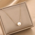 Elegant single white pearl necklace with rose gold chain on a premium jewelry gift box - Rose Gold