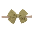 Detail of olive green polka dot bow headband with soft stretch nylon for infants - Olive Green