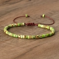 Adjustable woven bracelet with green emperor stone beads and golden spacers - No.43 Green Imperial Stone