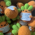 Handmade crochet carrot dolls with cute faces holding inspirational message cards - Chubby Carrot