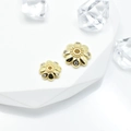 Golden flower-shaped bead spacers with rhinestones on a white geometric display stand - Style 9