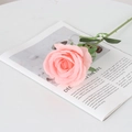 Single pink velvet artificial rose placed on a minimalist magazine for wedding decor - Round Silk Coral Pink