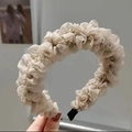 Detailed view of the pleated beige tulle fabric texture on this stylish women's headband - Khaki