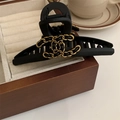 Elegant black mesh hair claw with gold chain flower design on a wooden jewelry box - 202# Black Leather Gold Chain Logo Claw