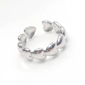 Close-up of a silver stainless steel open ring with interlocking heart-shaped design - Linked Hearts Design (R6061)