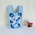Macro detail of butterfly knit tote bag fabric texture with blue and white floral pattern - Butterfly Blue