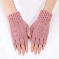 Detail of pink knit arm warmers with diamond hollow pattern and ribbed cuffs on hands - One Size / Dusky Pink