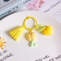 Creative yellow resin tulip keychain with heart pendant and matching tassel for women - Chubby Yellow Tulip
