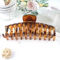 Oversized amber tortoiseshell hair claw clip with a secure grip for thick hair styling - Leopard Yellow