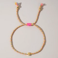 Handmade woven cord bracelet in pink and yellow with golden cross charm - Pink Yellow Blue Braided Cross