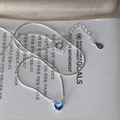 Macro shot of S925 sterling silver heart pendant with dark blue zircon on a fine chain - Deep Blue Heart Style (MY34853)