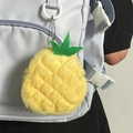 Cute plush pineapple coin purse with silver bead chain hanging on a blue backpack - Pineapple