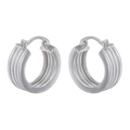 Macro shot of silver-colored ribbed oval hoop earrings with a metallic finish and buckle - VE968 Platinum