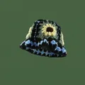 Handmade crochet bucket hat featuring vibrant sunflower patterns and blue wave edging - One Size / Black Sunflower Hat