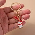 Gros plan du porte-clés de Noël avec bonhomme de neige, sucre d'orge et breloques - Bonhomme de neige