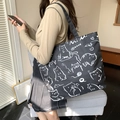 Black canvas tote bag with white cat illustration and Mi Mi lettering on the shoulder - MIMI Cat - Black