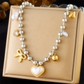 Detail of layered silver beaded necklace with gold bow, heart and pearl pendants - Bow/Heart/Pearl/Crystal Style (N3248)