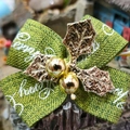 Close-up of green fabric holiday bow with Happy Holidays text and golden holly leaf detail - Style 18-Green Fabric Holiday Print Gold Leaf