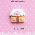 Macro view of 2.2x2.5cm glitter gingerbread house resin charm for DIY phone case crafts - Yellow Little House