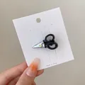 Creative scissors shaped hair clip in black and silver on white display card - Mini Scissors