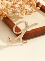 Elegant gold letter H brooch pin featuring sparkling crystal rhinestones on linen - Gold Letter X