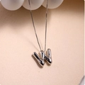 Detailed macro view of 3D balloon letter W pendant with polished silver finish on box chain - Silver (With Necklace) W
