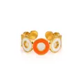 Detail view of adjustable gold-plated ring with orange and white enamel discs - Zj179