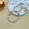 Detailed macro view of handcrafted colorful woven bracelet with silver square pendant - Colored Rope Silver Spacers Bracelet: Longevity and Riches