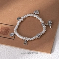 Ethnic silver bead bracelet with auspicious charms on vintage brown background - L506-3 Wealth and Good Luck