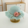 Close-up of light blue straw sun hat with delicate hollow lace brim and floral decorations - Hat Only / Blue Hat